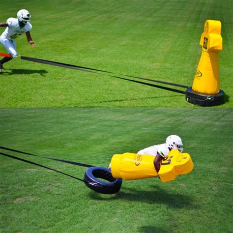 moving football tackling dummies.